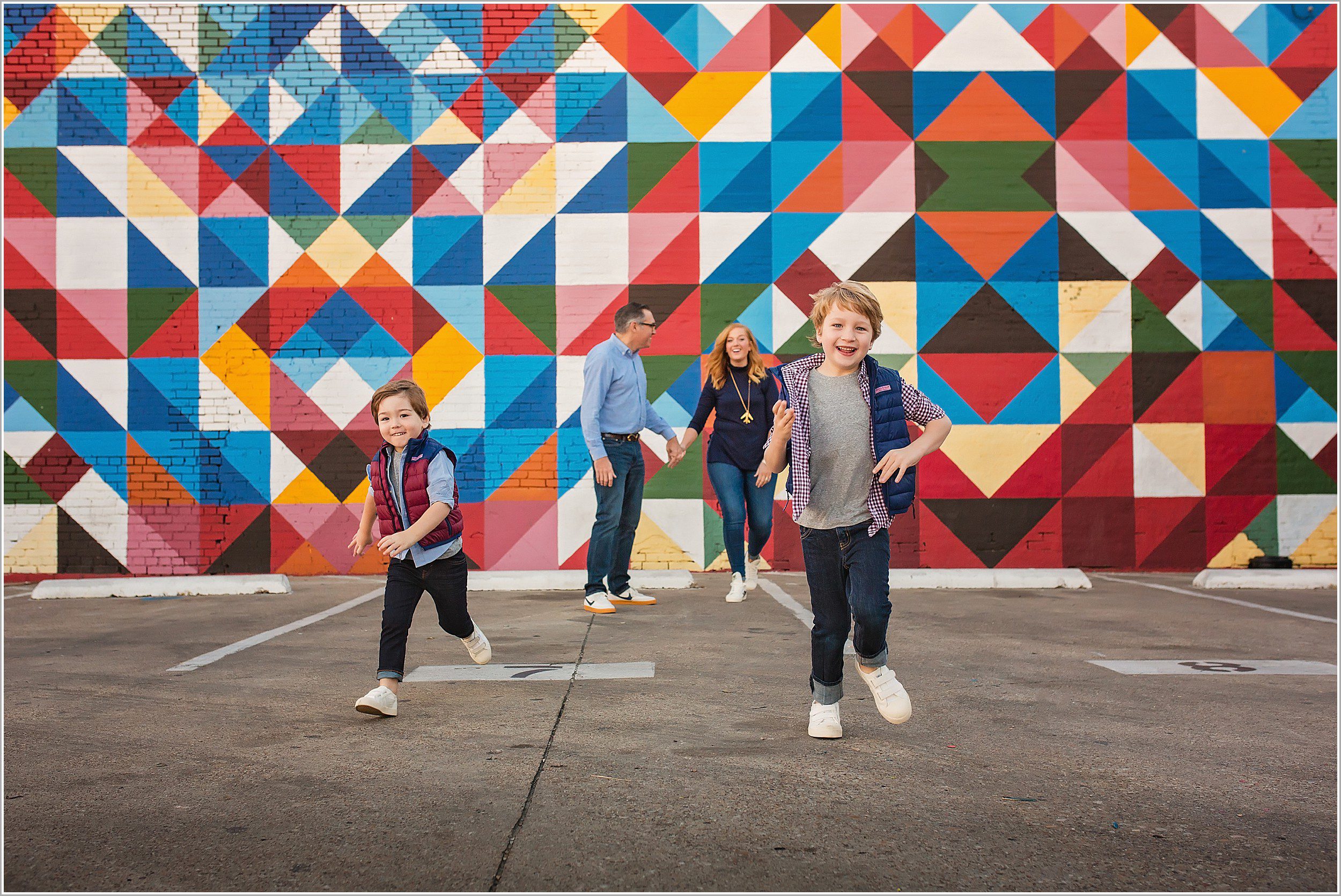 family playing in front of quilt wall in deep ellum dallas texas