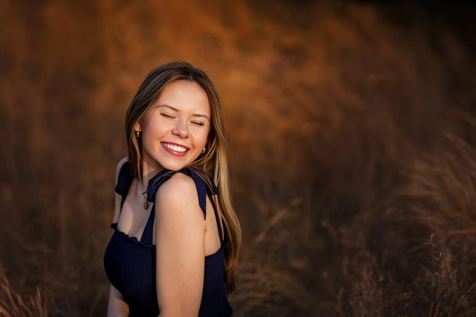 An OKC grad is photographed by high school photographer Missy Mayo