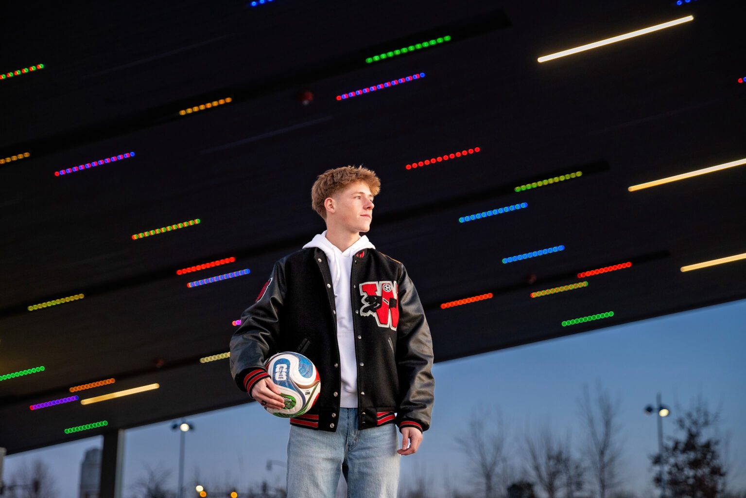 oklahoma city senior guy holding a soccer ball