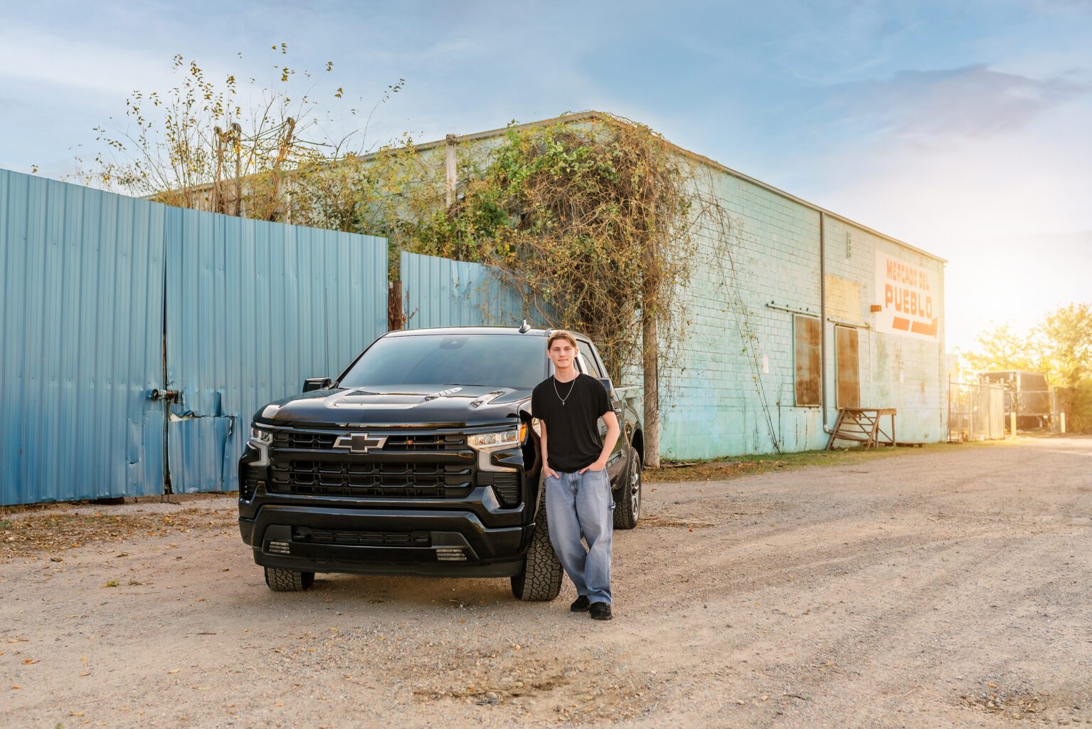 senior guy poses with his truck in oklahoma city