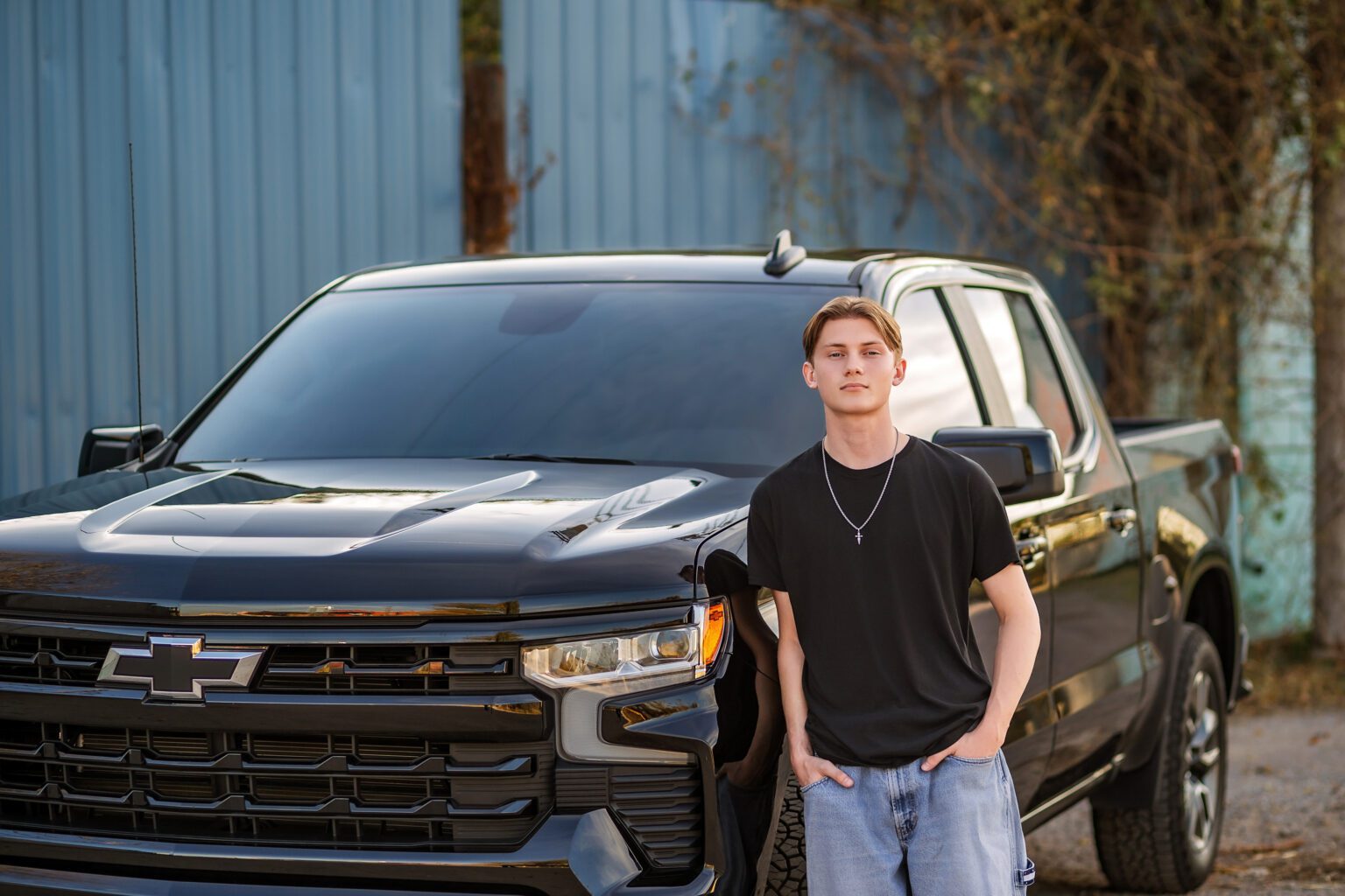 Senior guy posing with his truck in Urban Photo Session Oklahoma City Downtown Farmer's Market for Missy Mayo Photography